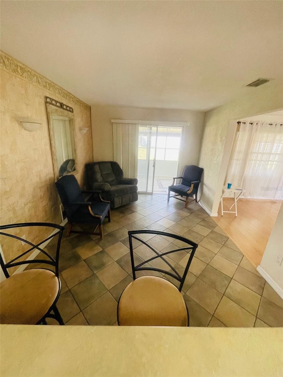 Dining room view from Kitchen - 999 ELEANOR AVE, DELTONA