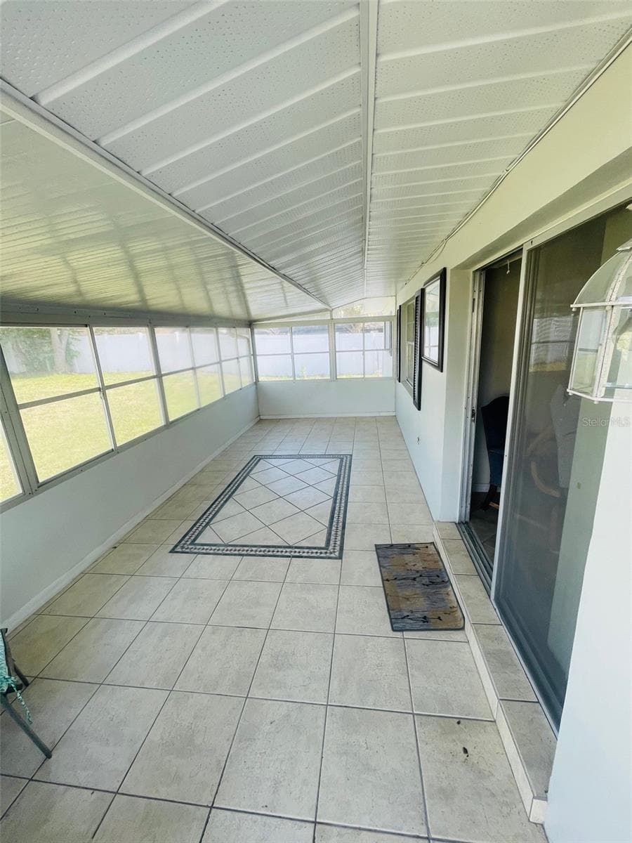 Enclosed rear porch - 999 ELEANOR AVE, DELTONA