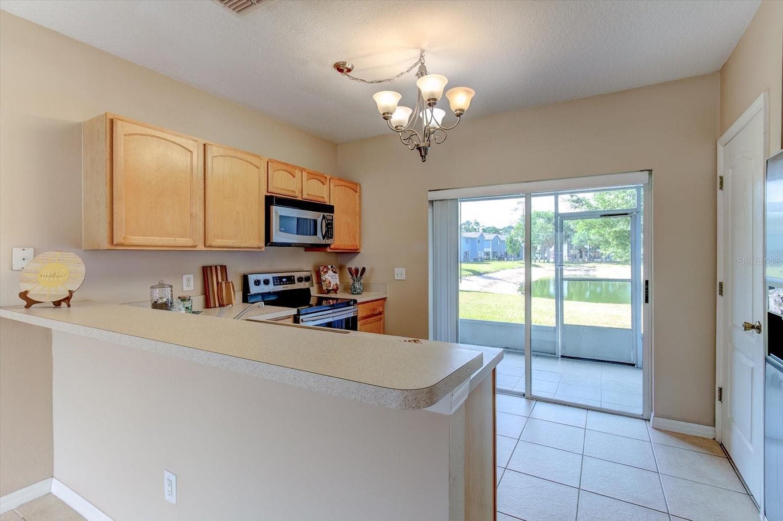 Breakfast Bar in kitchen with views of the pond - 509 WILTON CIR, SANFORD