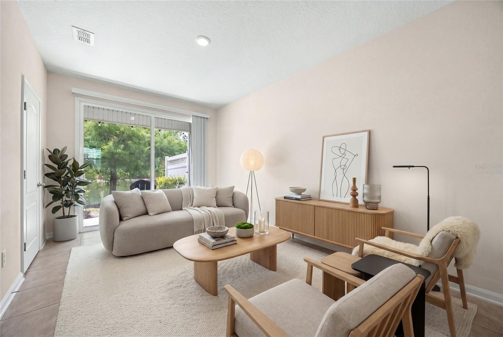 virtually staged great room - 585 RUNNING WOODS ST, ORANGE PARK