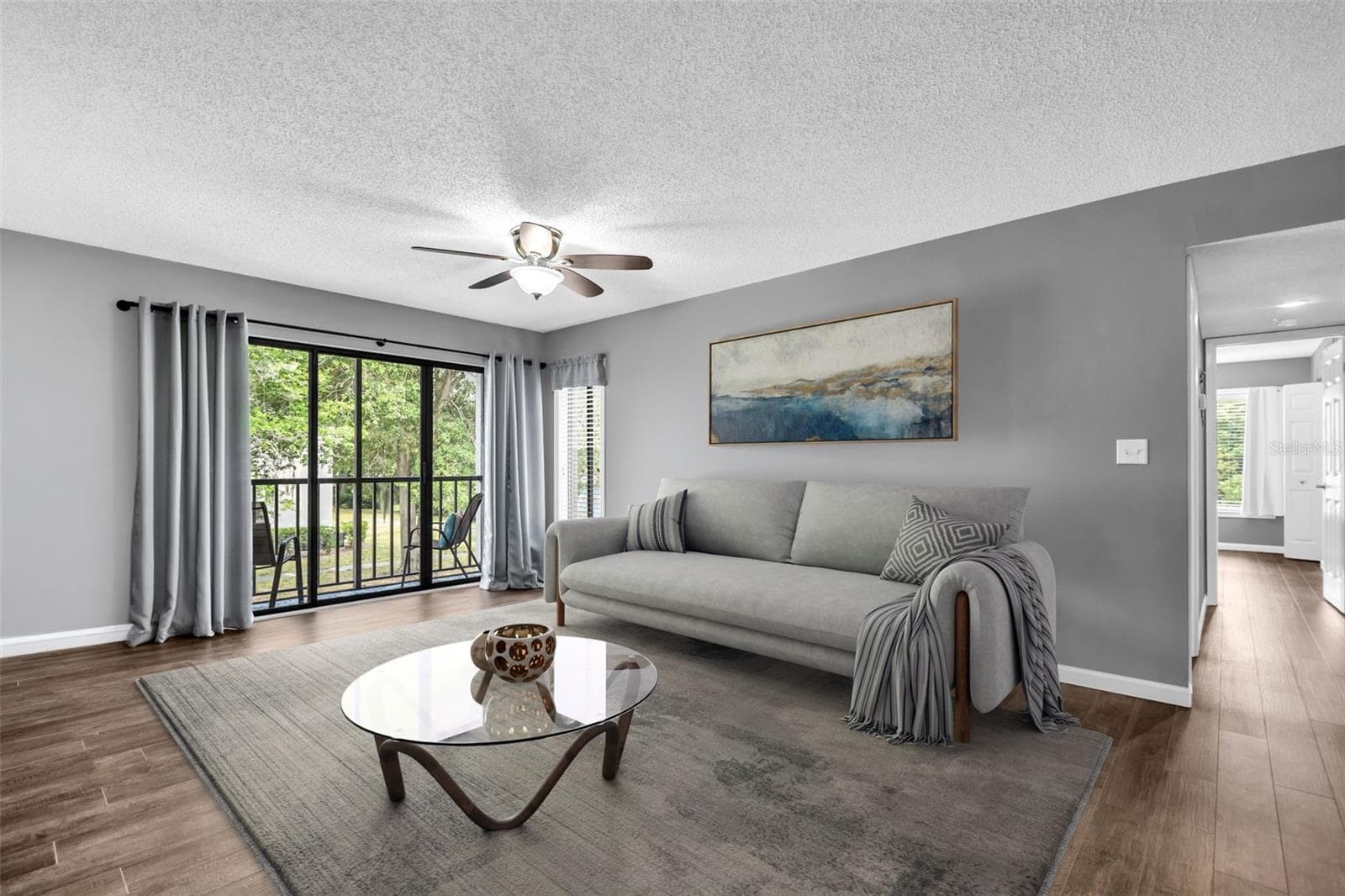 Beautiful luxury vinyl plank flooring, large glass sliders out to screened lanai offering year-round enjoyment~ - 2642 PINE RIDGE WAY S #G2, PALM HARBOR