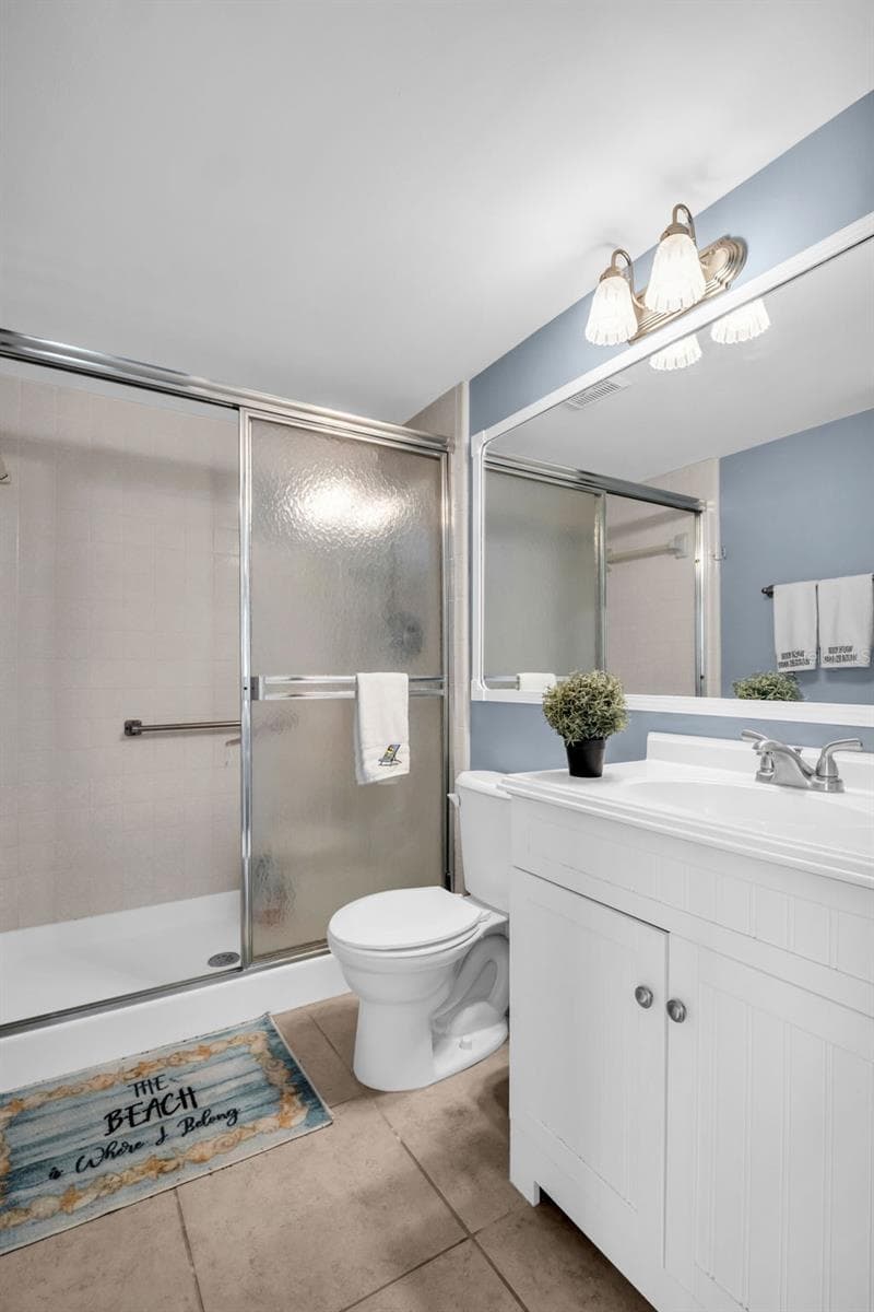 Primary en-suite with updated vanity and conveniently walk-in shower~ - 2642 PINE RIDGE WAY S #G2, PALM HARBOR