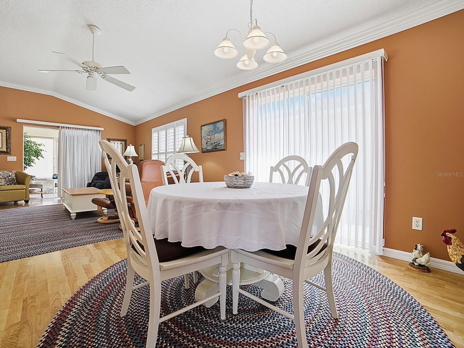 Dining area with patio doors to side yard - 7631 SE 170TH LONGVIEW LN, THE VILLAGES