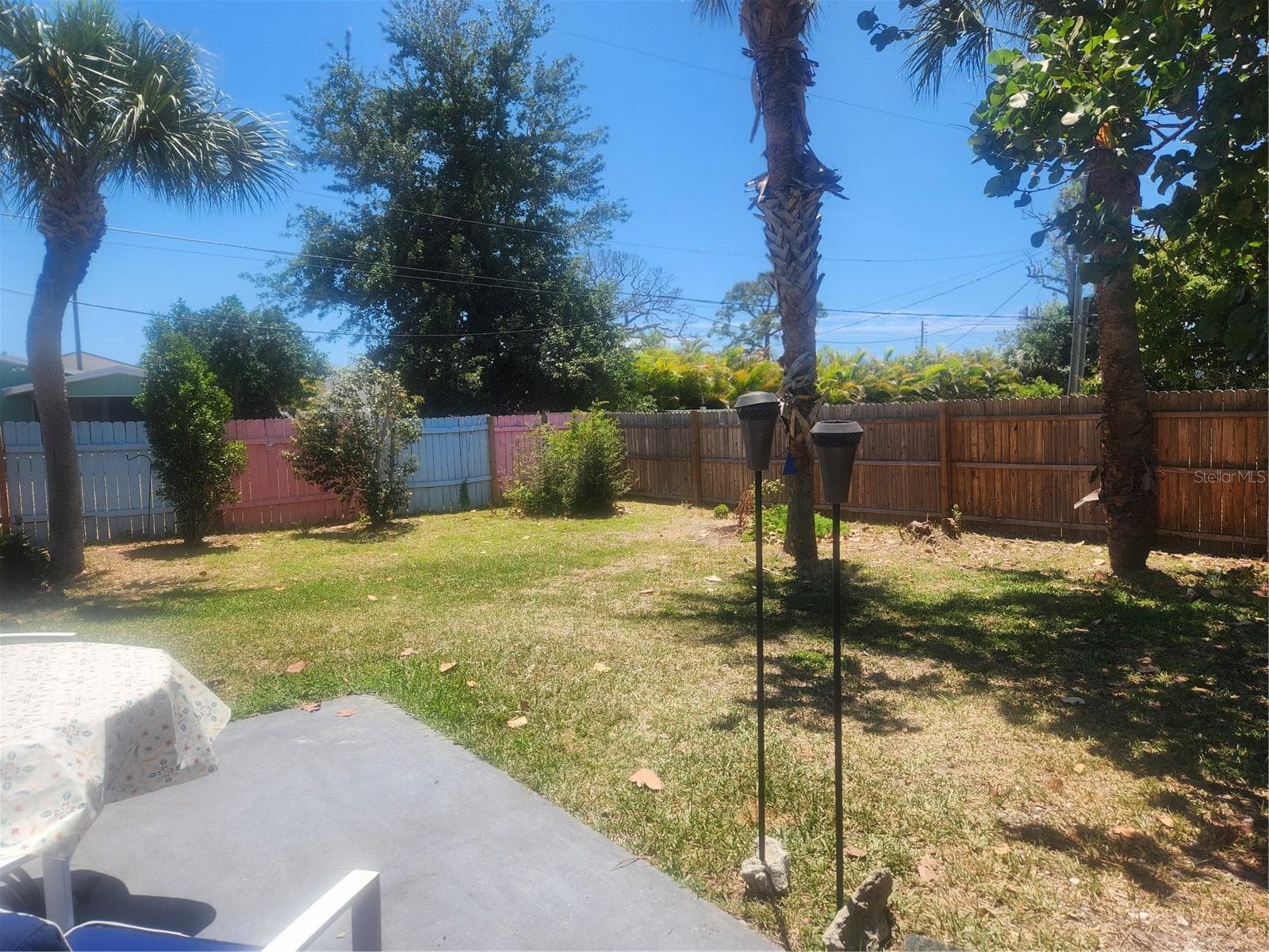 Extra large backyard to Enjoy backyard barbeques, corn hole, family and friends get togethers.  More than enough space to design your new pool - 316 ALBA ST E, VENICE