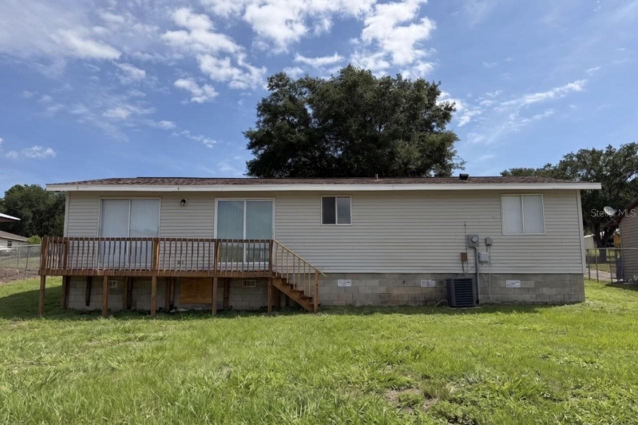 Rear of Home-virtual grass - 514 GREENBROUGH DR, LAKE WALES