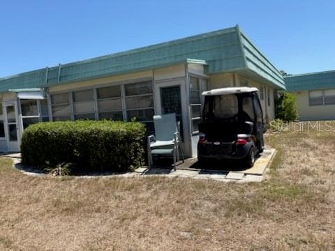 Golf cart pad - 101 CAMBRIDGE TRL #200, SUN CITY CENTER