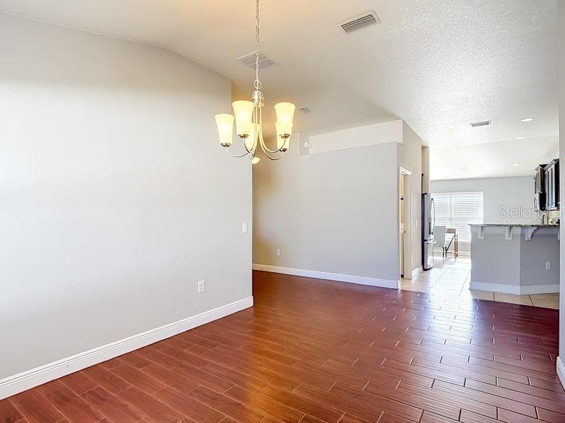 Dining room looking into kitchen - 12244 LOOPBACK DR, SAN ANTONIO