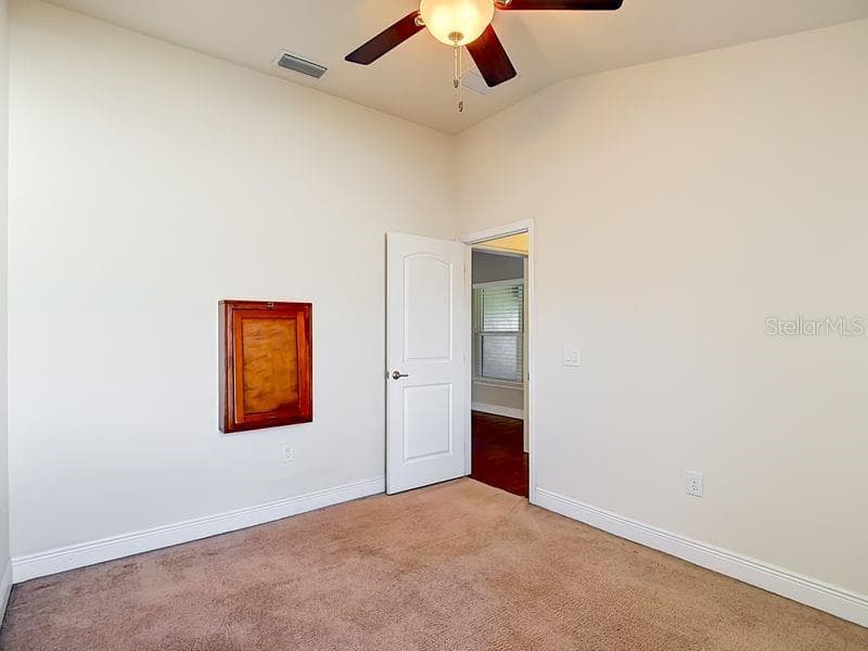 Bedroom 2 - A comfortable guest or secondary bedroom featuring neutral tones! - 12244 LOOPBACK DR, SAN ANTONIO