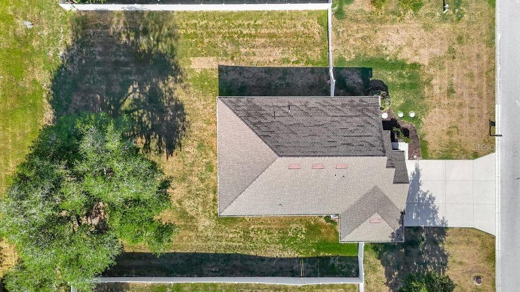 Aerial perspective showcasing the property's expansive nearly half-acre lot - 12244 LOOPBACK DR, SAN ANTONIO