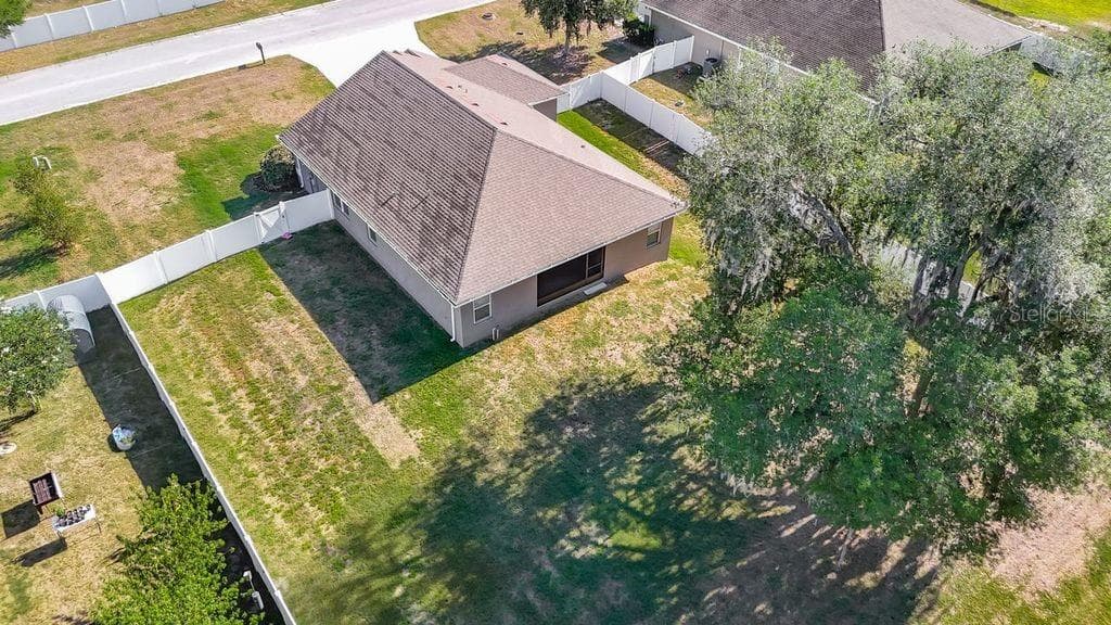 Aerial perspective showcasing the property's expansive nearly half-acre lot - 12244 LOOPBACK DR, SAN ANTONIO