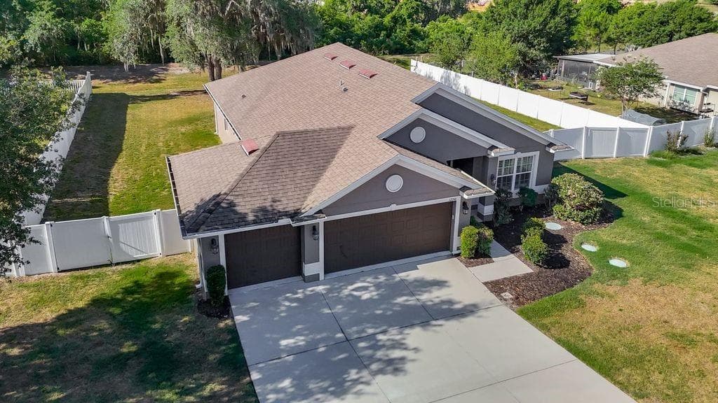 Aerial perspective showcasing the property's expansive nearly half-acre lot - 12244 LOOPBACK DR, SAN ANTONIO