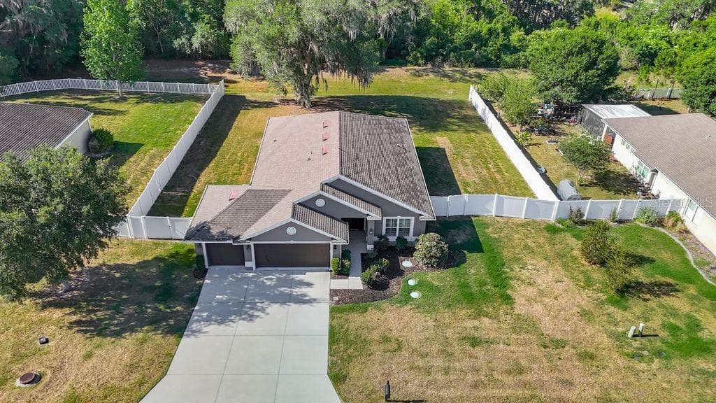 Aerial perspective showcasing the property's expansive nearly half-acre lot - 12244 LOOPBACK DR, SAN ANTONIO