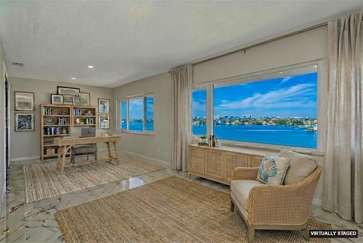 Virtual staging of Living and flex space - 100 BLUFF VIEW DR #604C, BELLEAIR BLUFFS