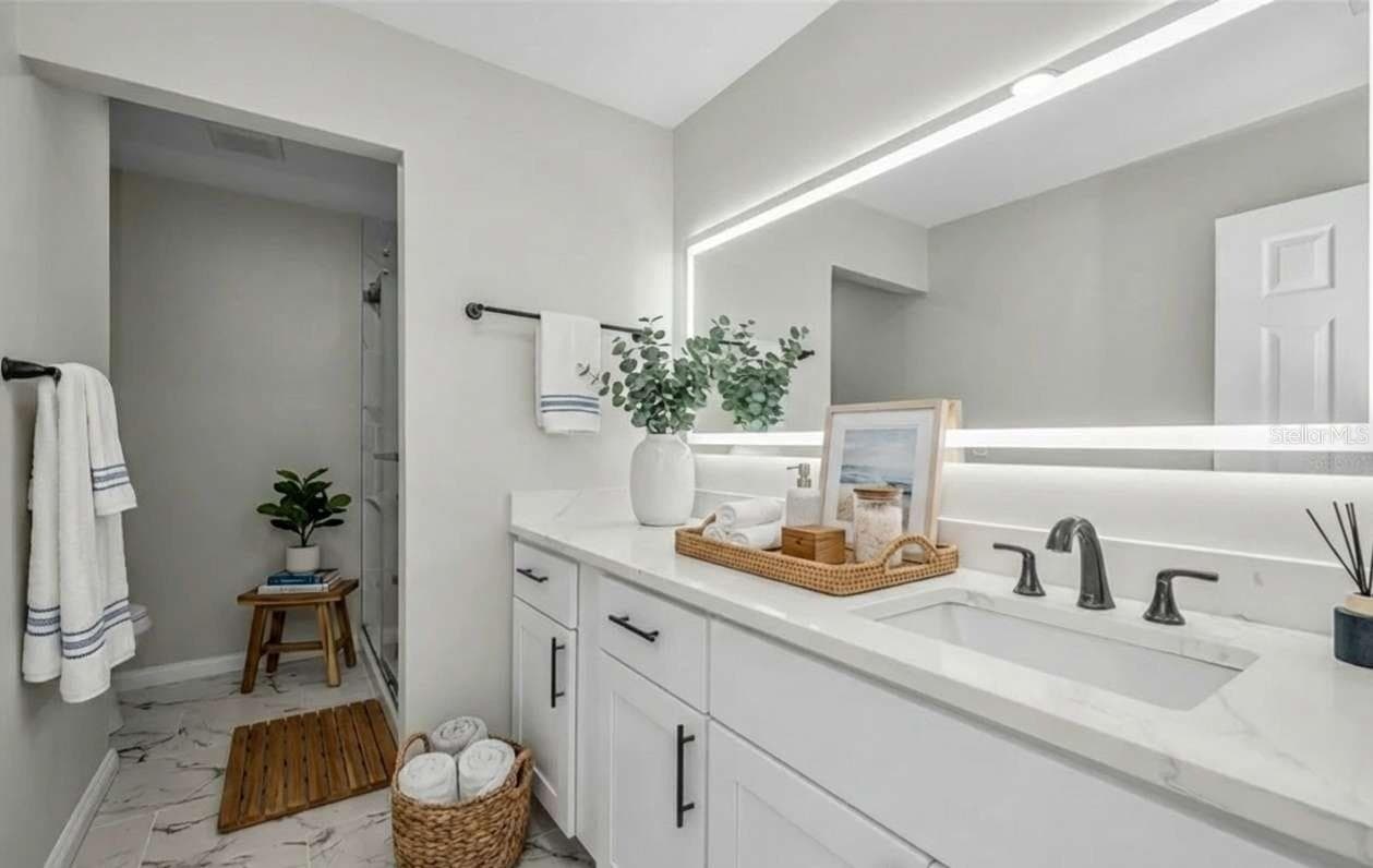 Master bathroom virtual staging - 100 BLUFF VIEW DR #604C, BELLEAIR BLUFFS