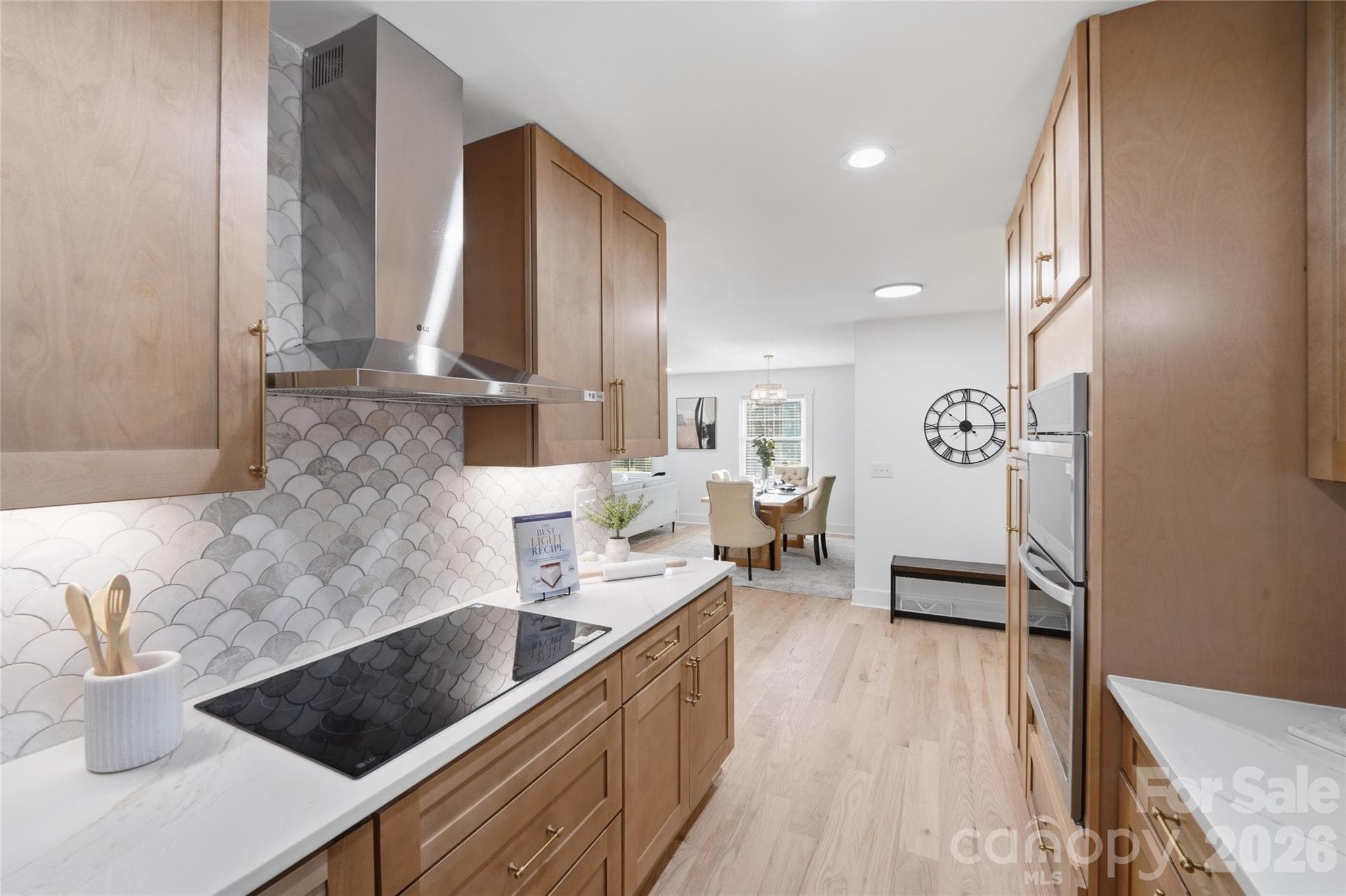 Tile backsplash incorporates the color scheme perfectly! - 4314 Ivanhoe Place, Charlotte