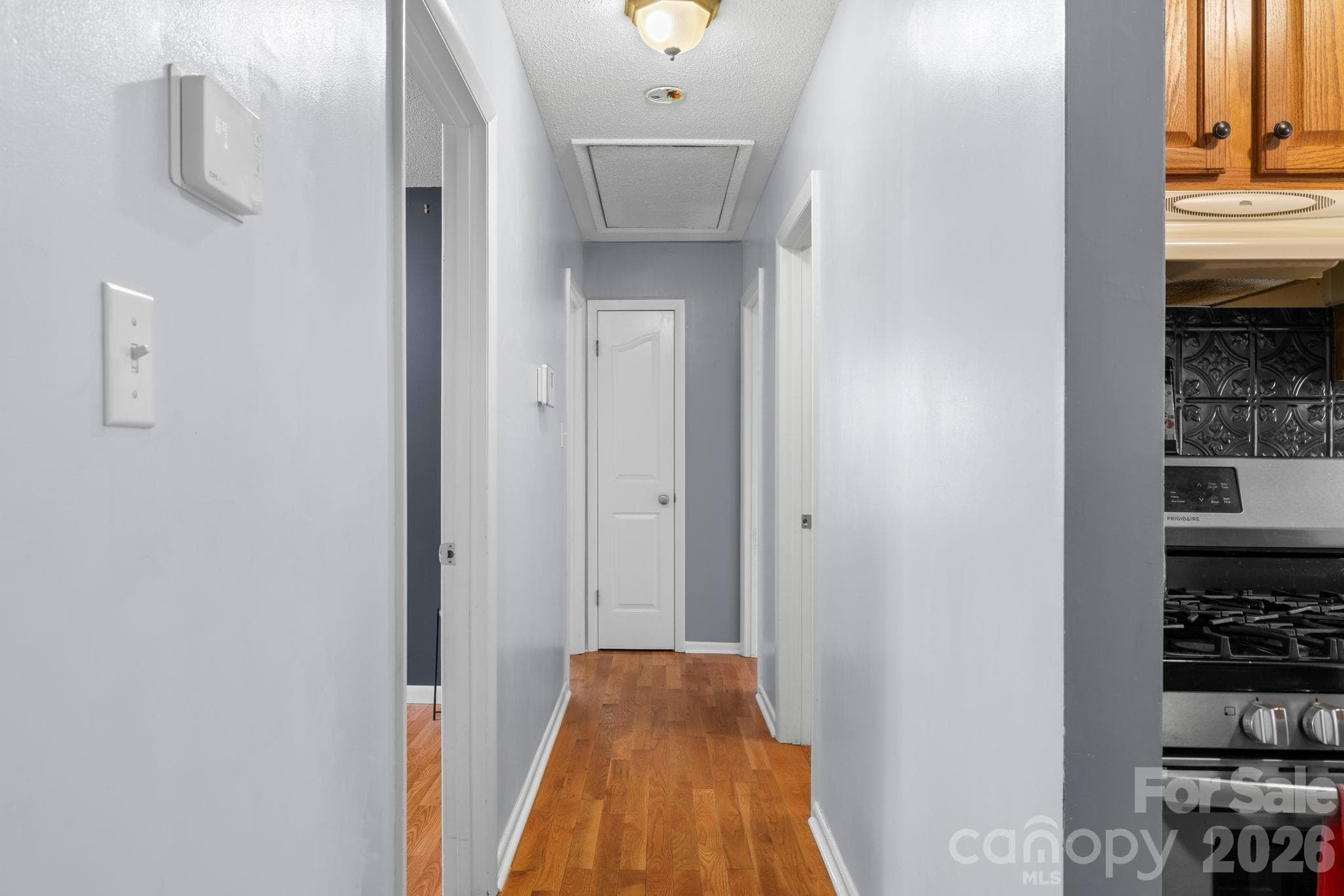 Hallway to bedrooms from living room - 98 Pensacola Avenue, Arden