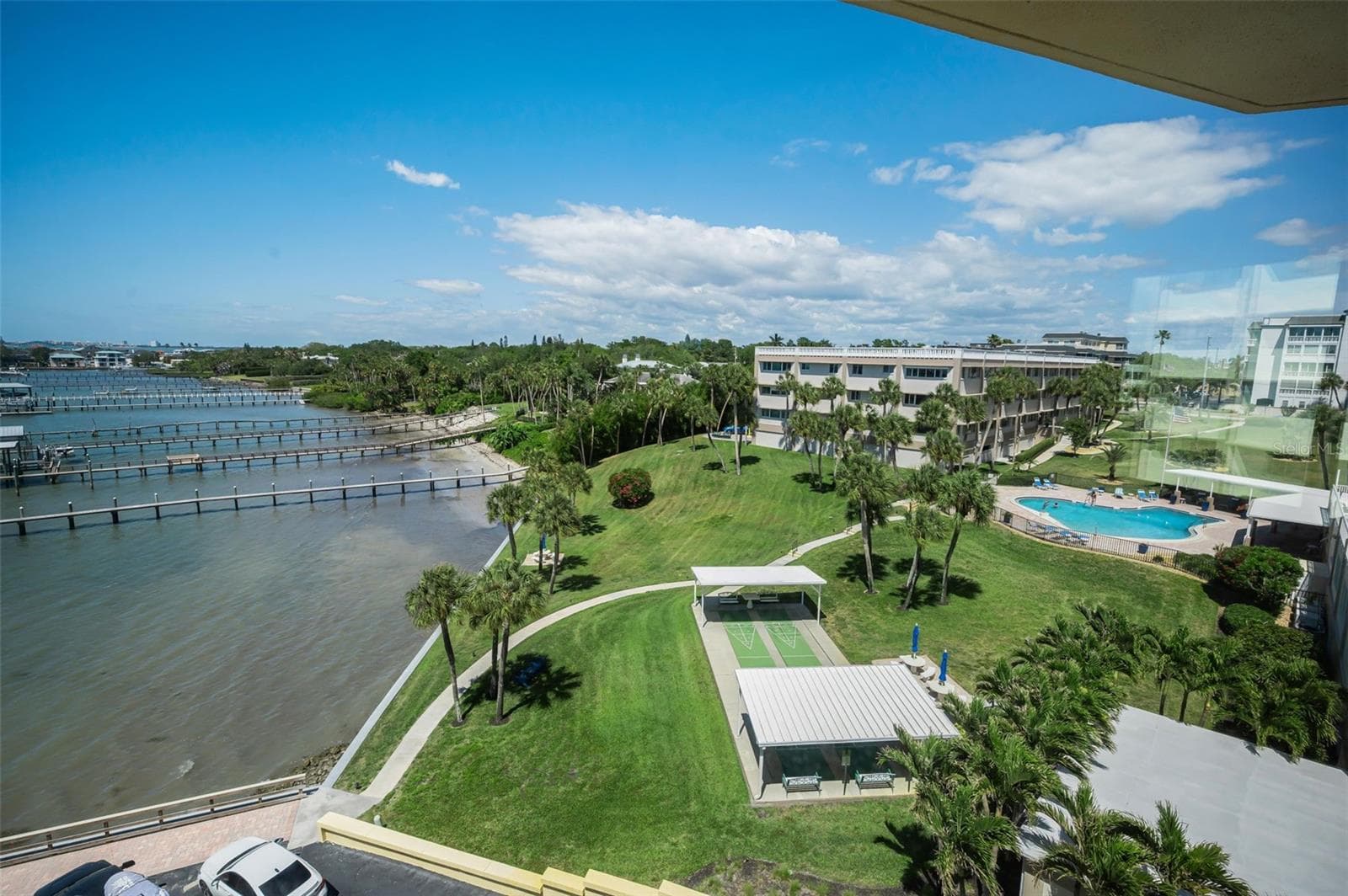 View of Bay and community pool - 100 BLUFF VIEW DR #514C, BELLEAIR BLUFFS