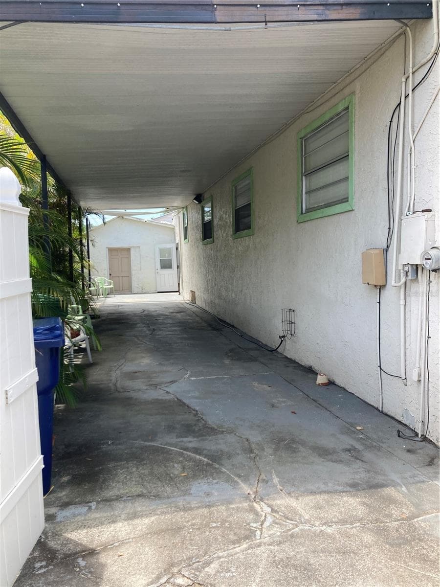 Long covered carport. - 2405 CORRINE ST, TAMPA