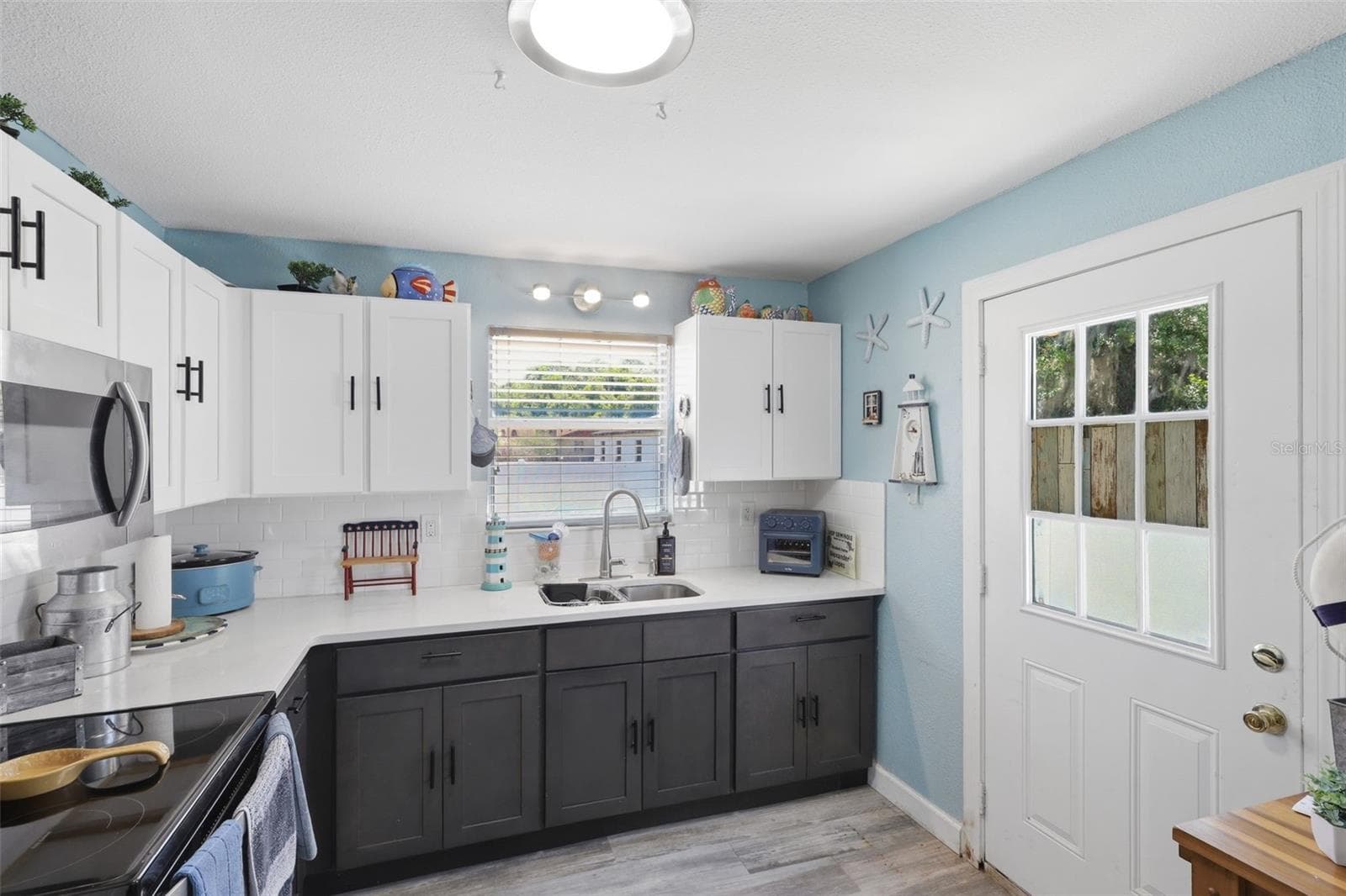 View of kitchen toward backyard. - 2559 HARRY T MOORE AVE, MIMS
