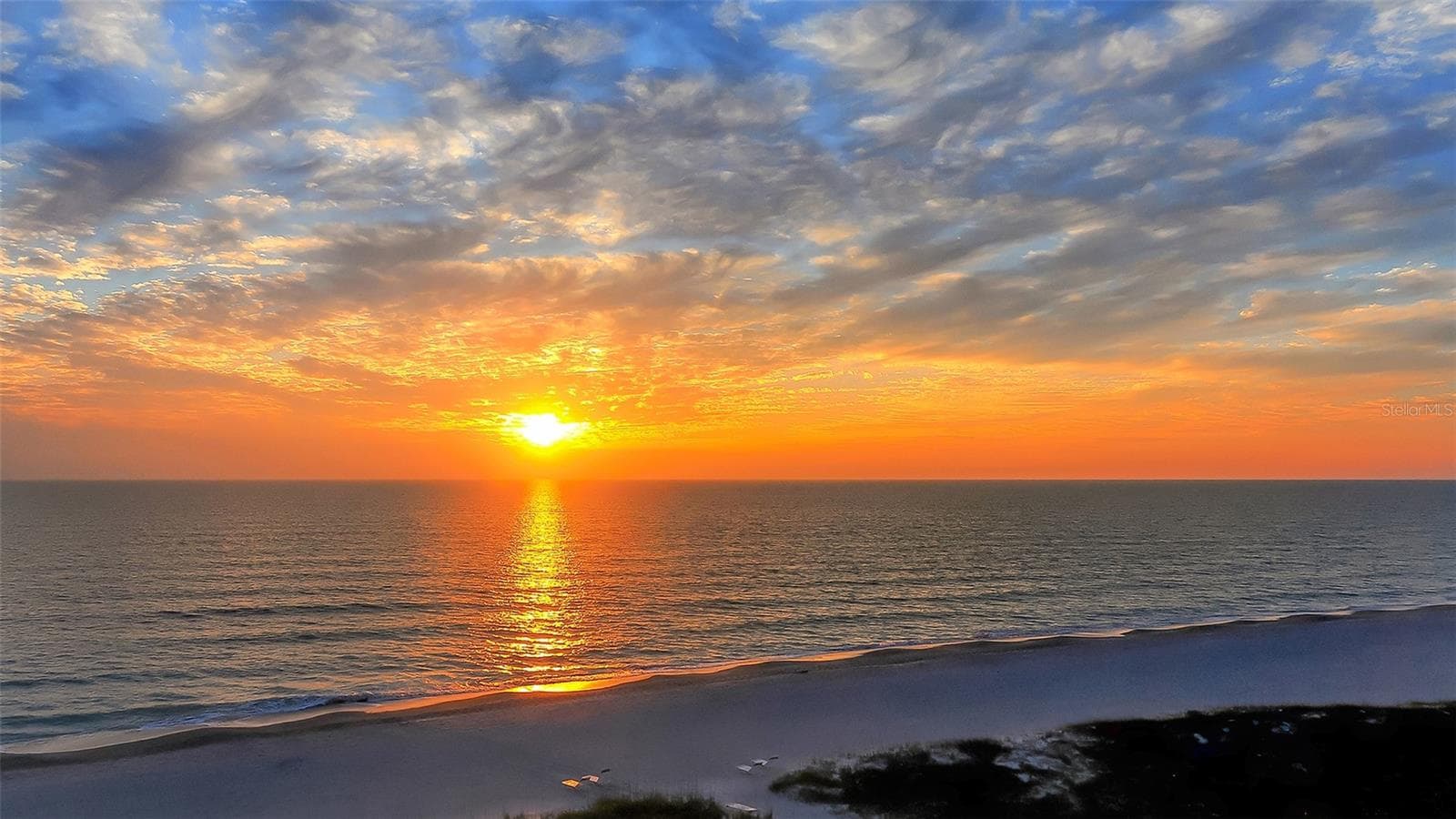 Breathtaking sunset over the Gulf at Whispering Sands. - 206 HOURGLASS WAY #V10, SARASOTA