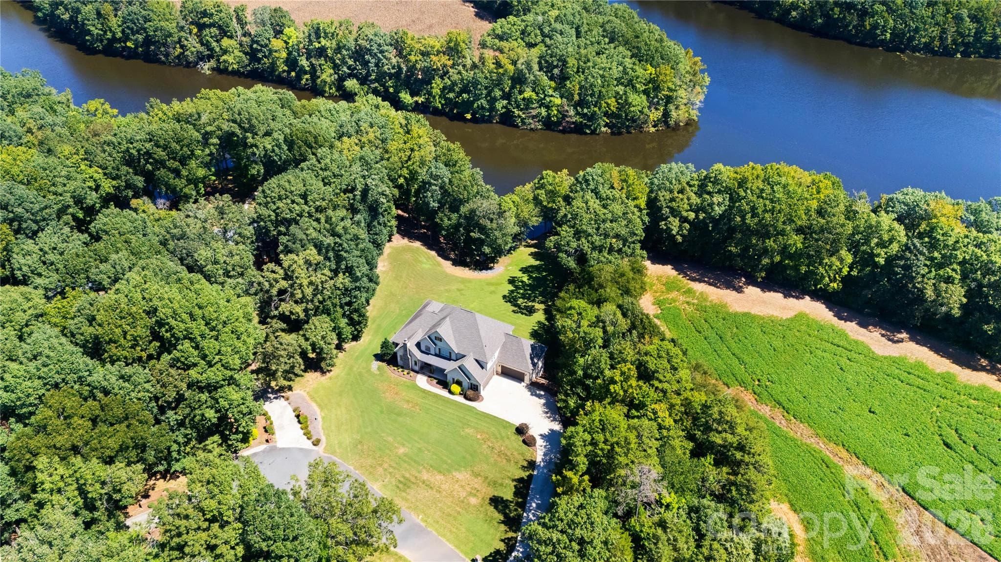 Aerial view of the home with Lake Twitty behind the home. - Monroe