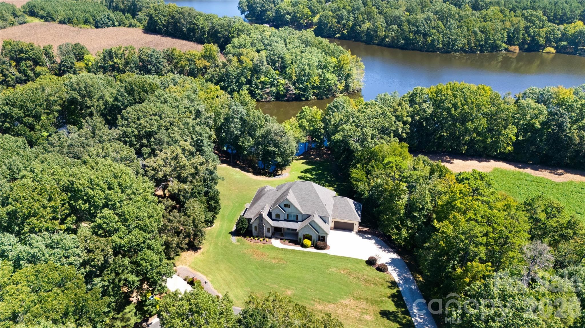 Aerial view of the wooded lot and lake - 3612 Lake Twitty Drive, Monroe