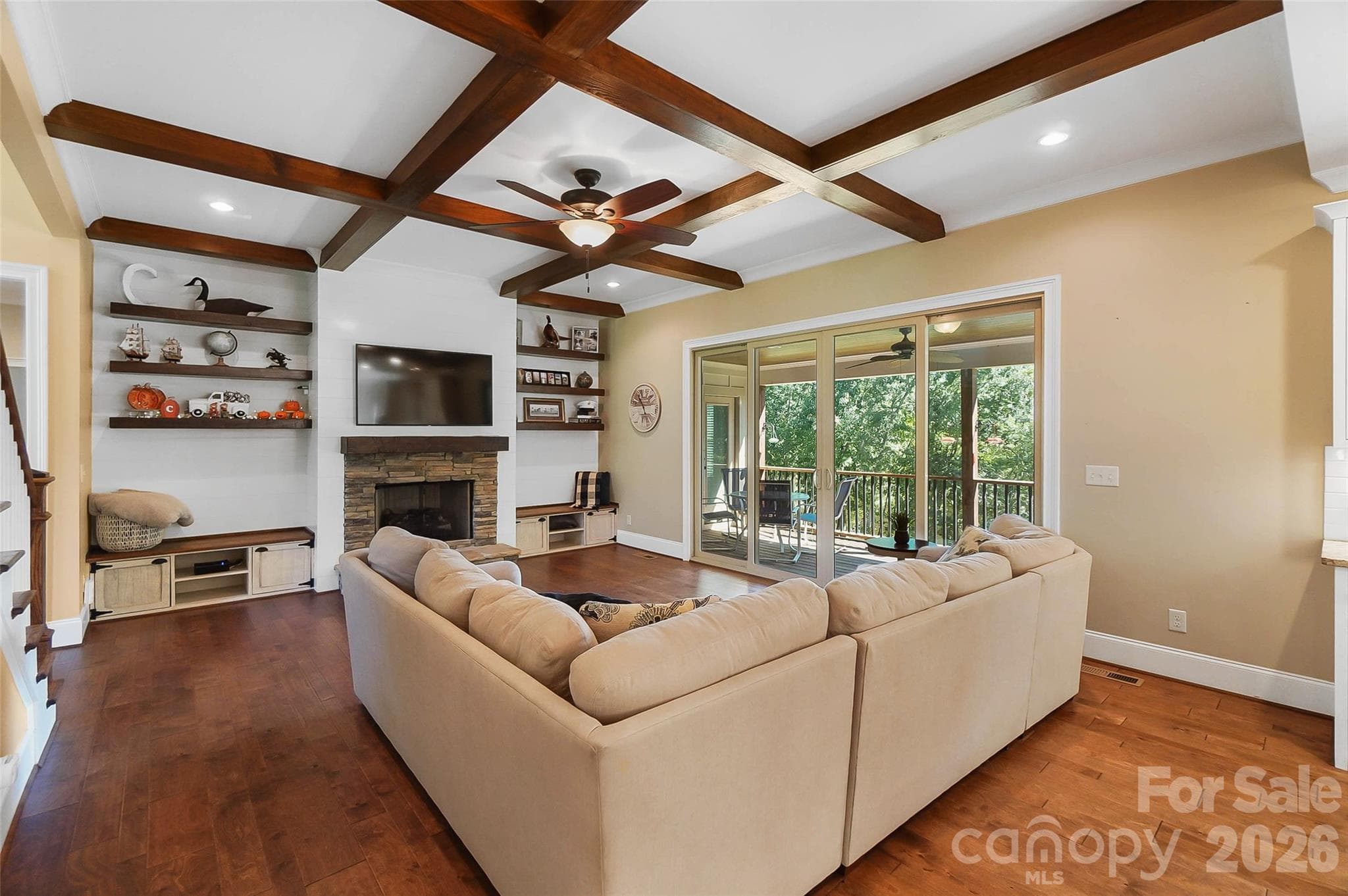 Living room with built-ins shelves and ceiling beams - 3612 Lake Twitty Drive, Monroe