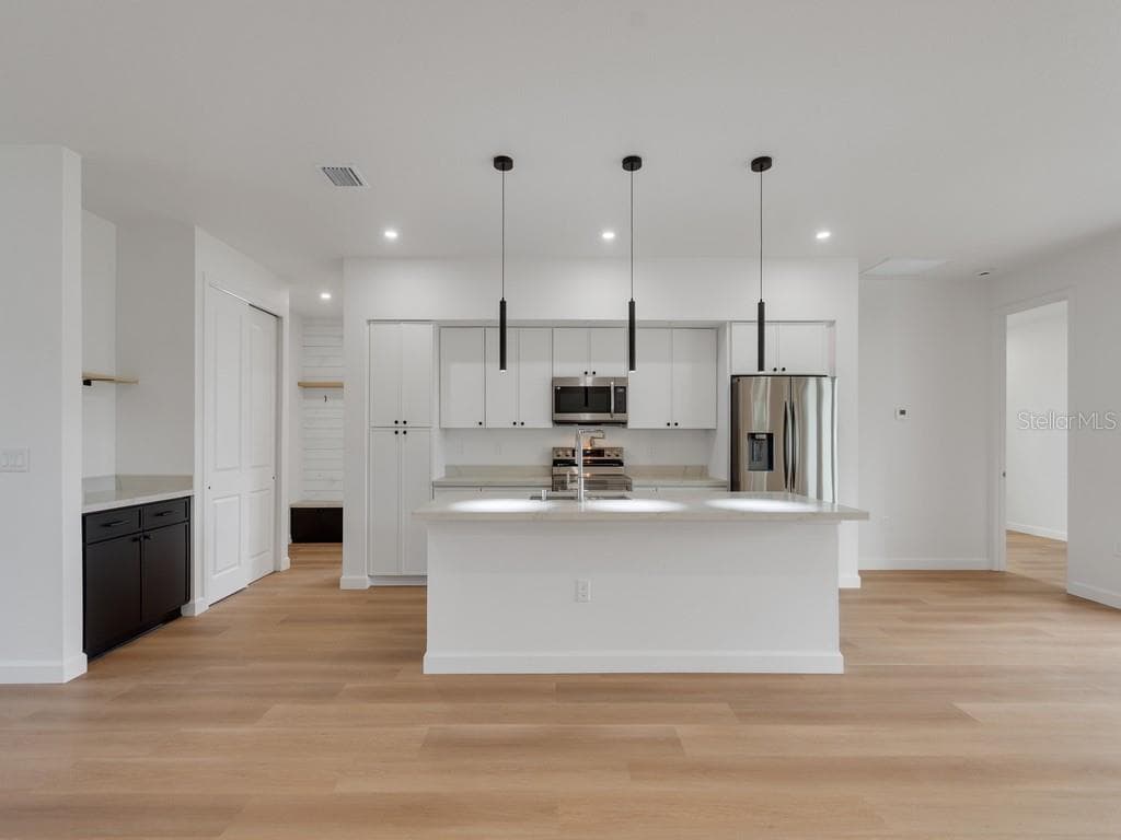 Kitchen with island - 2602 DE GROODT RD SW, PALM BAY