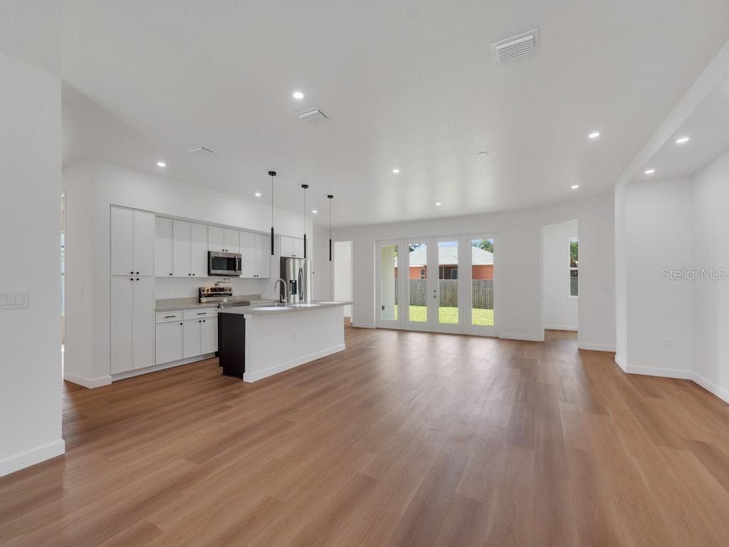 Family Room into kitchen - 2602 DE GROODT RD SW, PALM BAY