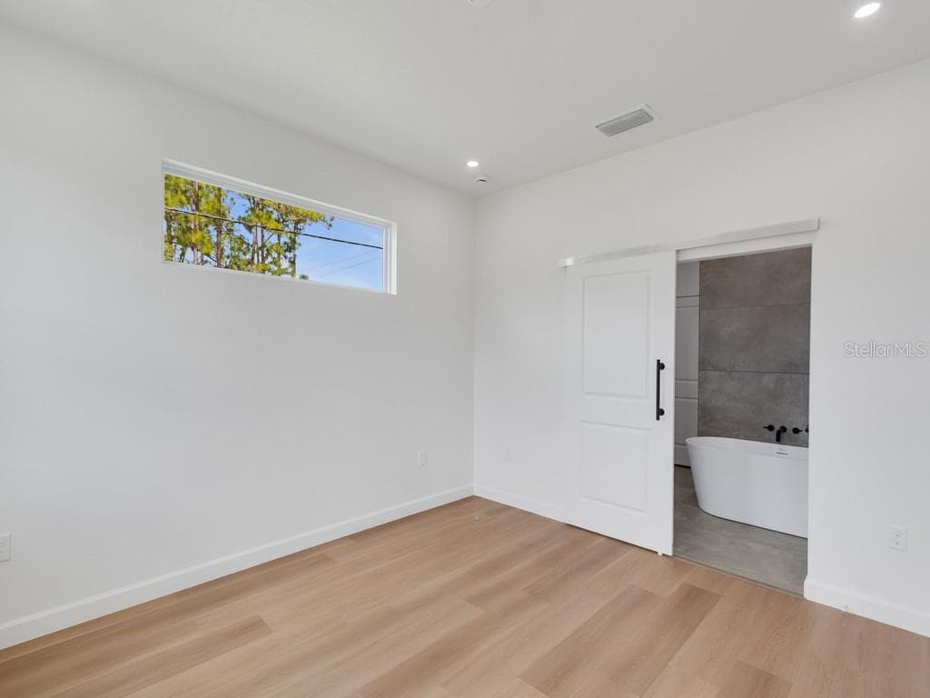 Primary Suite Bedroom - 2602 DE GROODT RD SW, PALM BAY