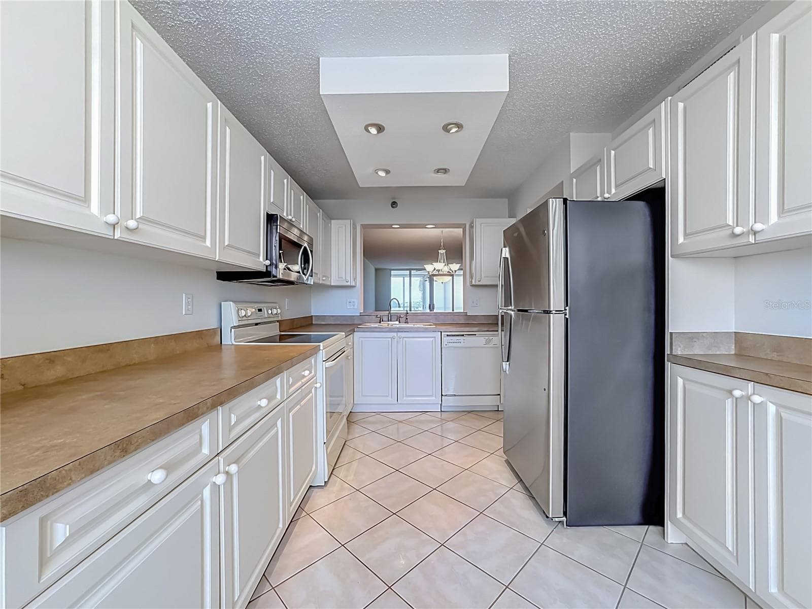 Full length view of the kitchen. - 3740 PINEBROOK CIR #607, BRADENTON