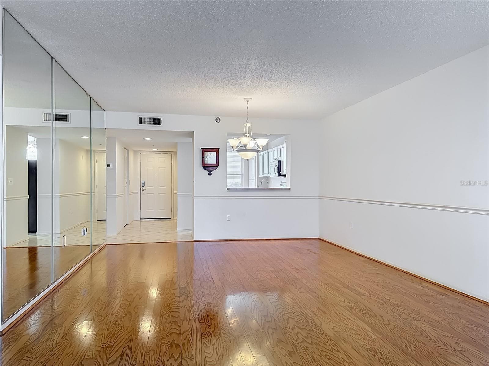 View from the living room into the dining area. - 3740 PINEBROOK CIR #607, BRADENTON