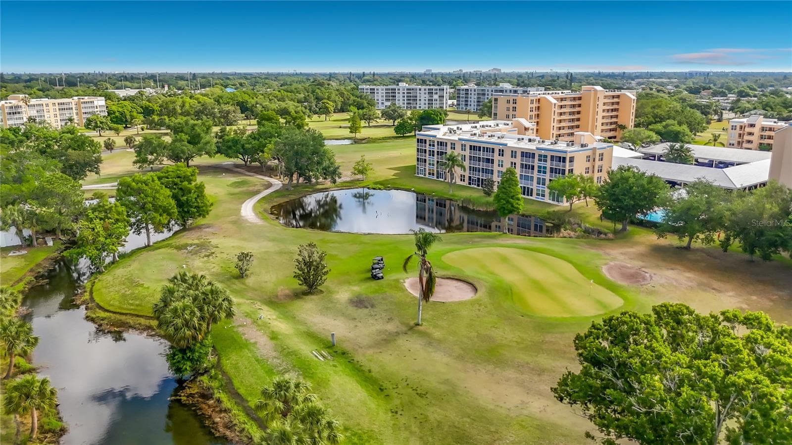 Aerial view of the golf course and back of the building. - 3740 PINEBROOK CIR #607, BRADENTON