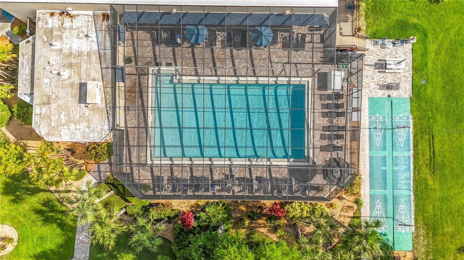Screen enclosed pool and shuffleboard courts. - 3740 PINEBROOK CIR #607, BRADENTON