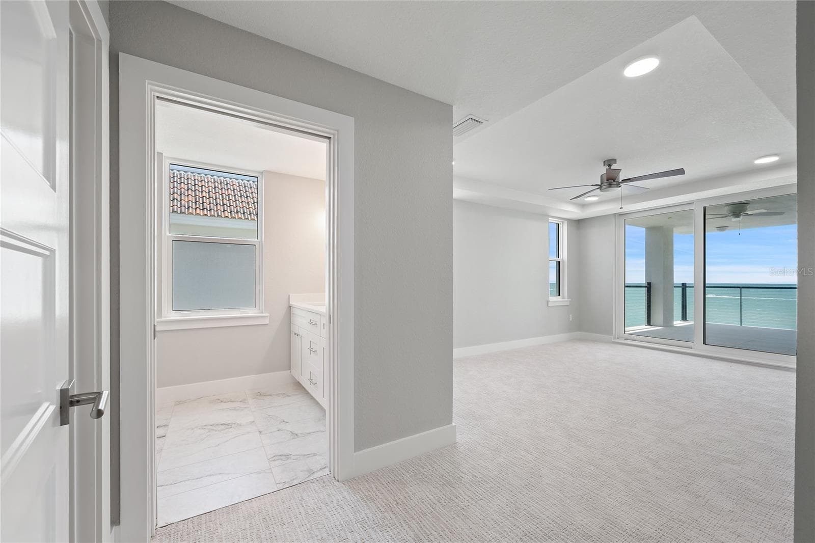 Primary with sliders to balcony - 14048 GULF BLVD #402, MADEIRA BEACH
