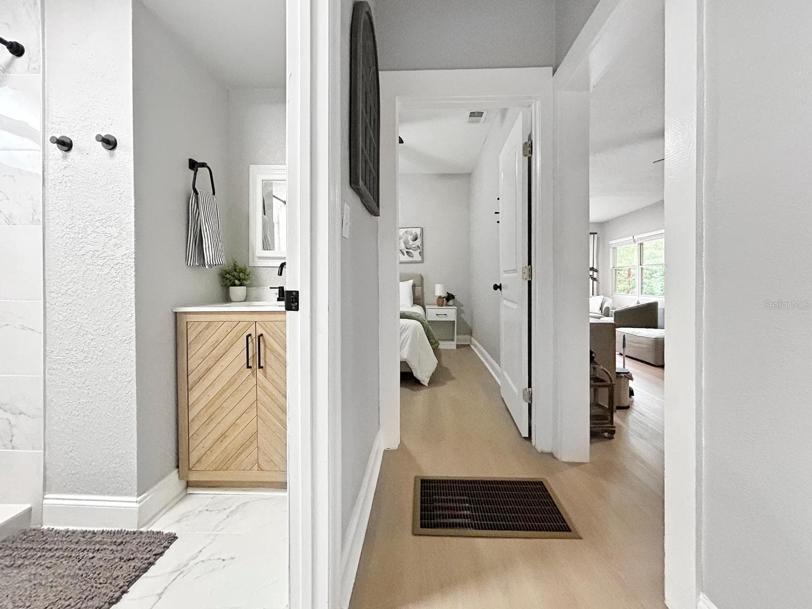 Peak of the bathroom and bedroom hallway - 1718 LAVON ST, LAKELAND
