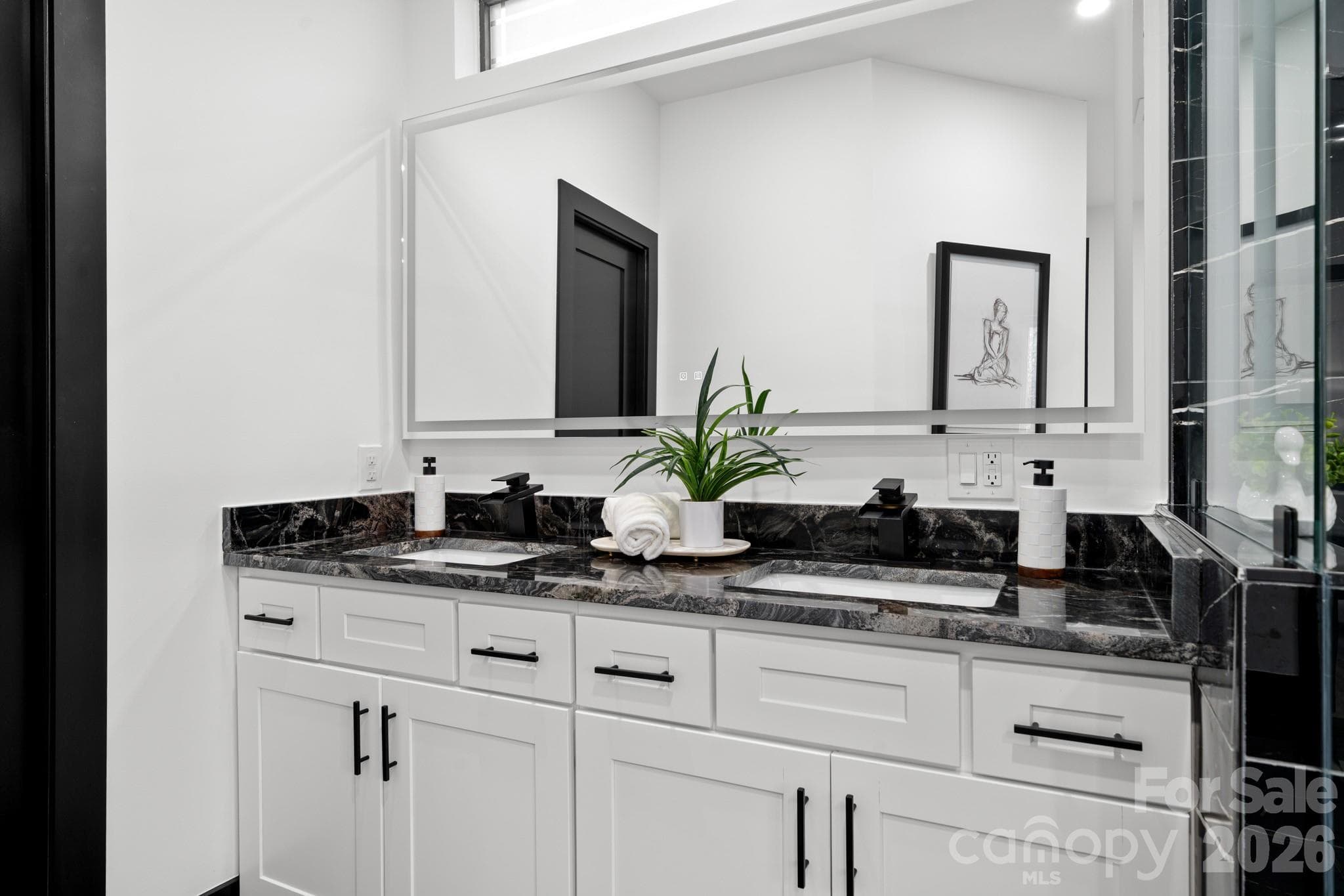Dual vanity primary bathroom, backlit mirror - 74 Jeranna Road, Mills River