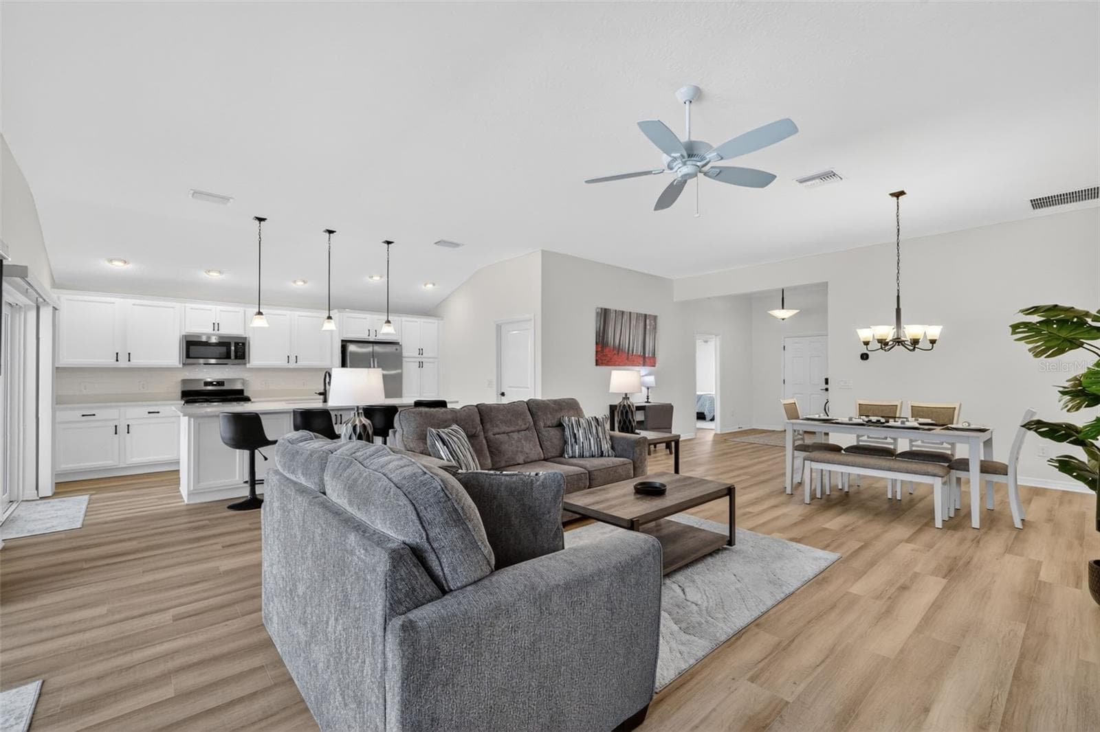 Living, Dining, and Kitchen - 6857 BAYSINGER PATH, THE VILLAGES
