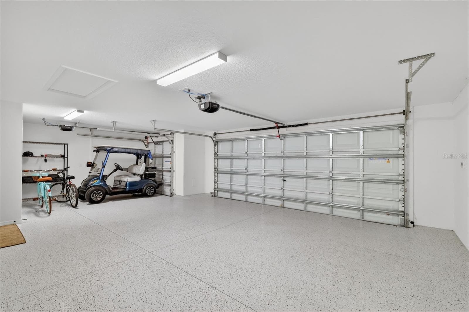 31'x21' Two Car +Golf Cart Garage with Epoxied Floor - 6857 BAYSINGER PATH, THE VILLAGES