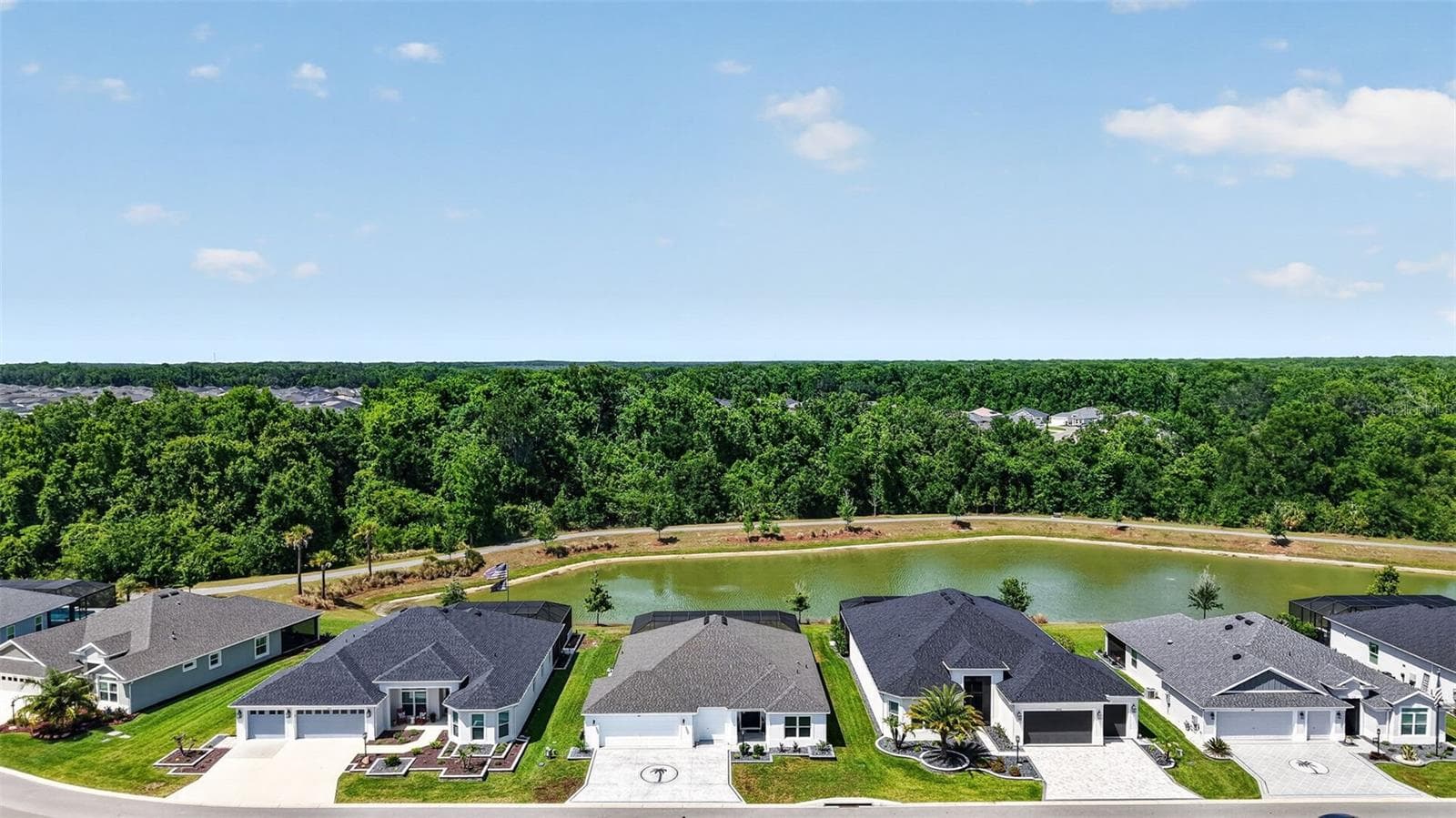 Aerial Front Elevation with Water Views - 6857 BAYSINGER PATH, THE VILLAGES