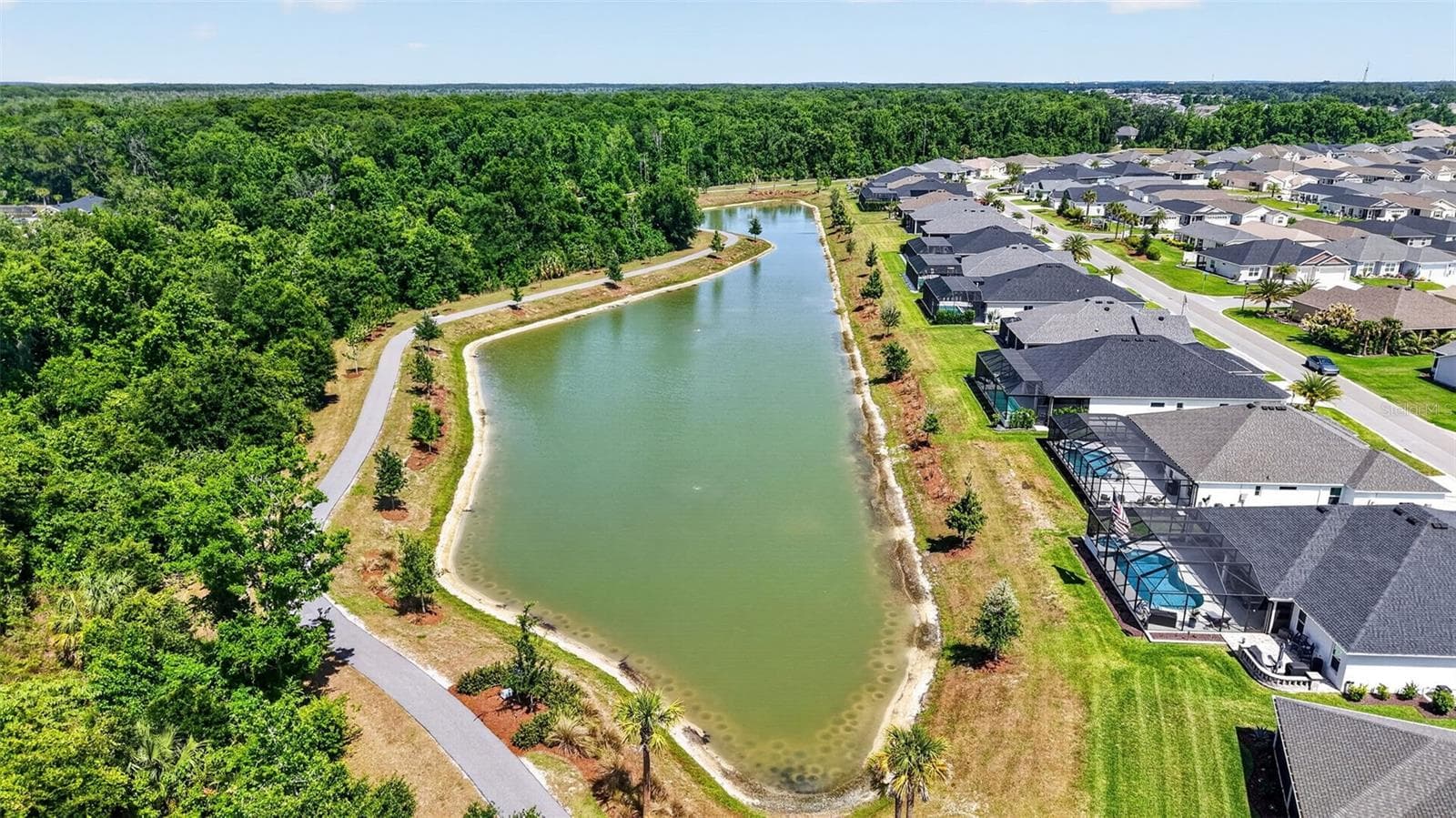 Aerial Side Elevation with Water Views and Walking Trails - 6857 BAYSINGER PATH, THE VILLAGES