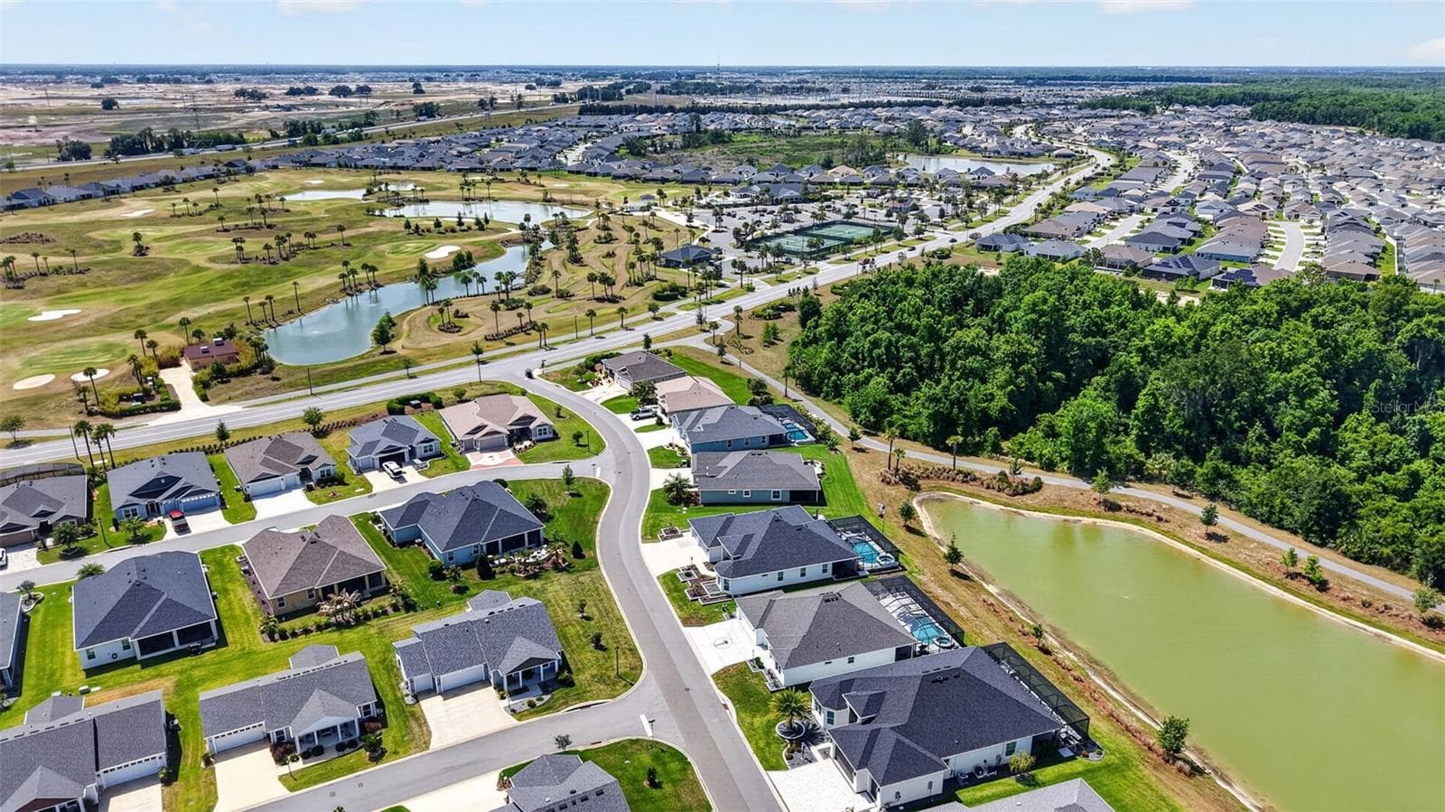 Aerial Side Elevation with Water Views and Walking Trails - 6857 BAYSINGER PATH, THE VILLAGES