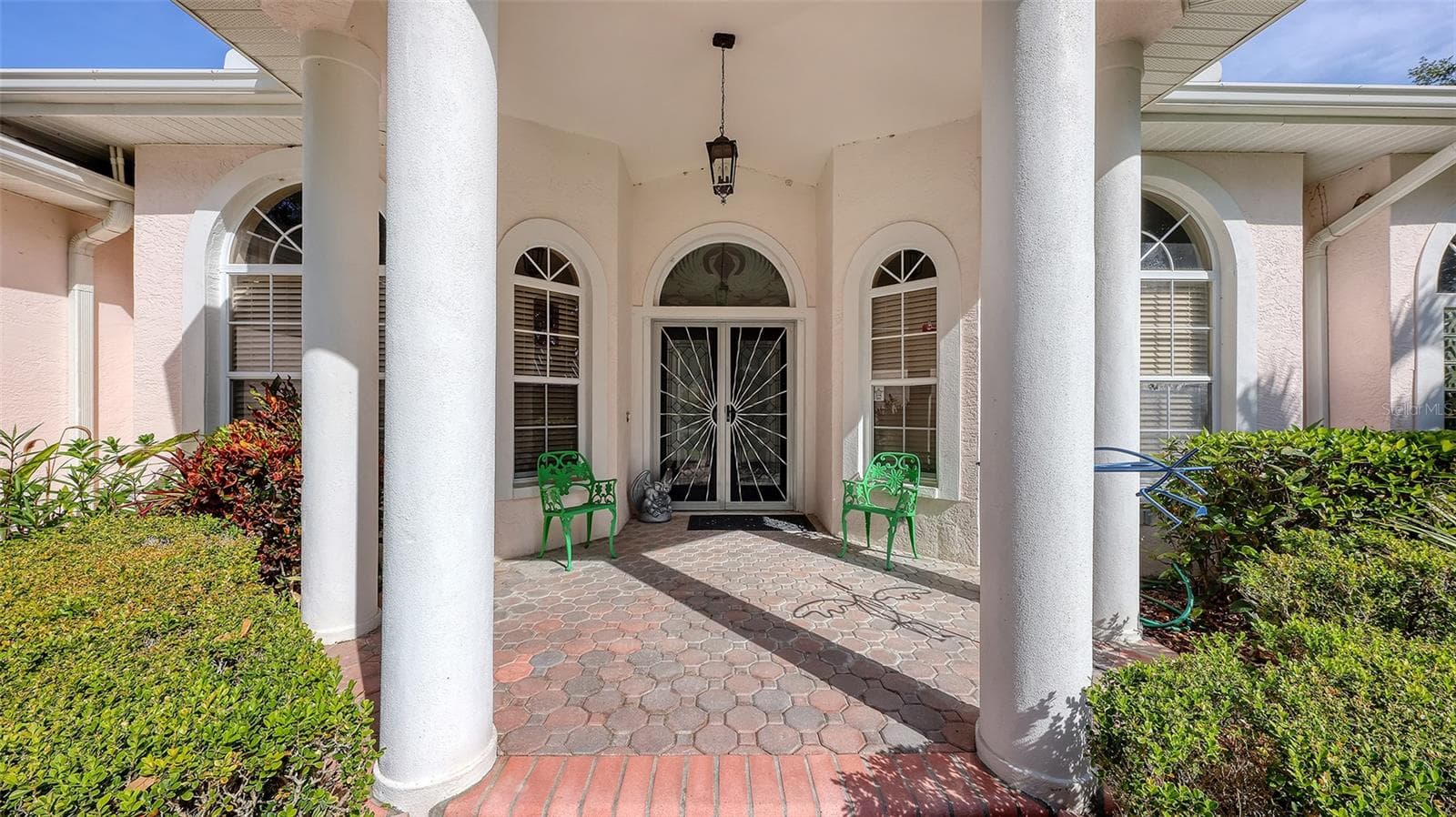 A Beautiful, Columned, Covered, Double Door Entry Greet you - 7025 N SERENOA DR, SARASOTA