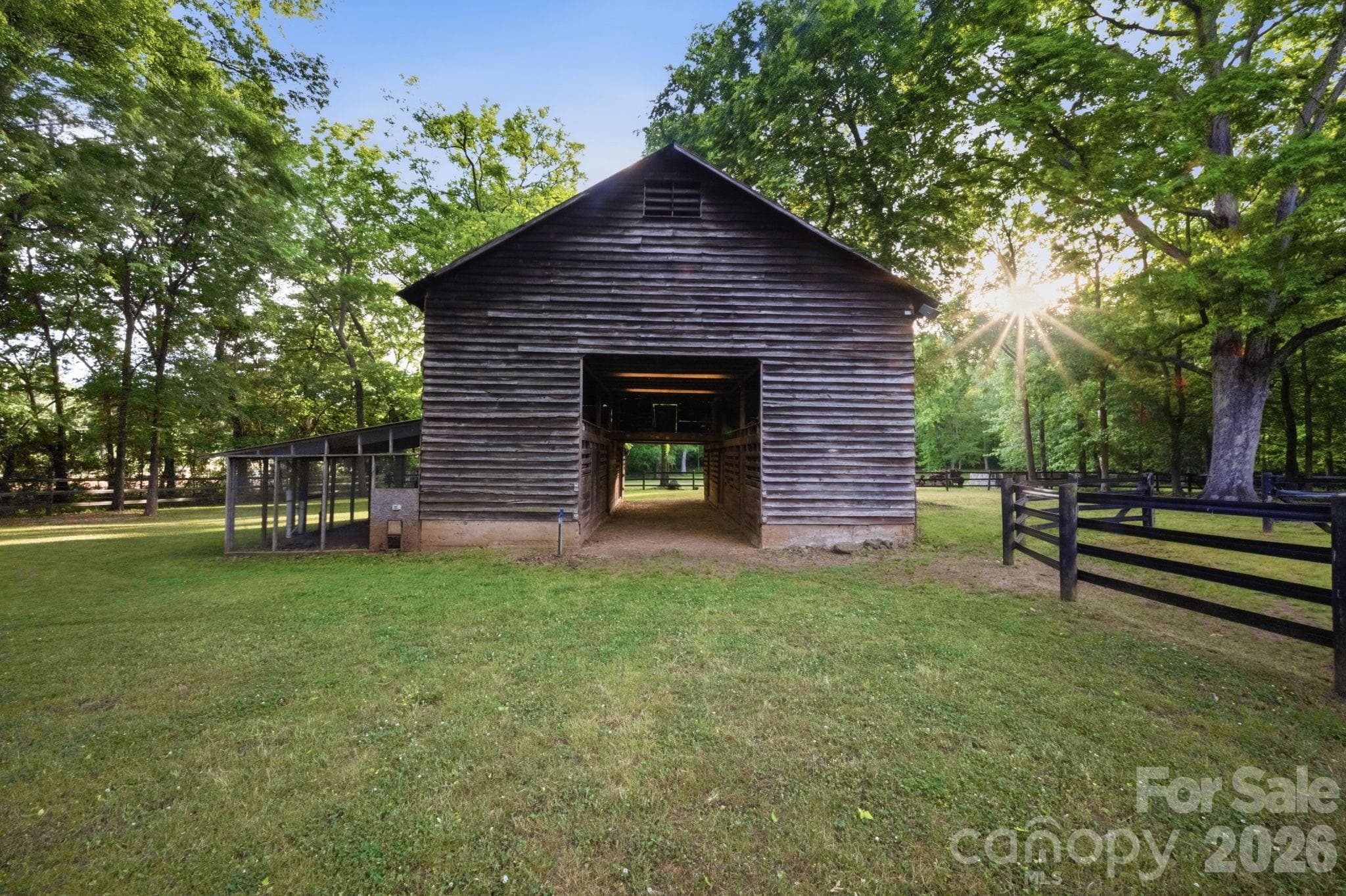 An 8 stall historic barn with an attached chicken coop and hay loft is ideal for your farm animals of choice making this an ideal sustainable hobby farm. - Huntersville