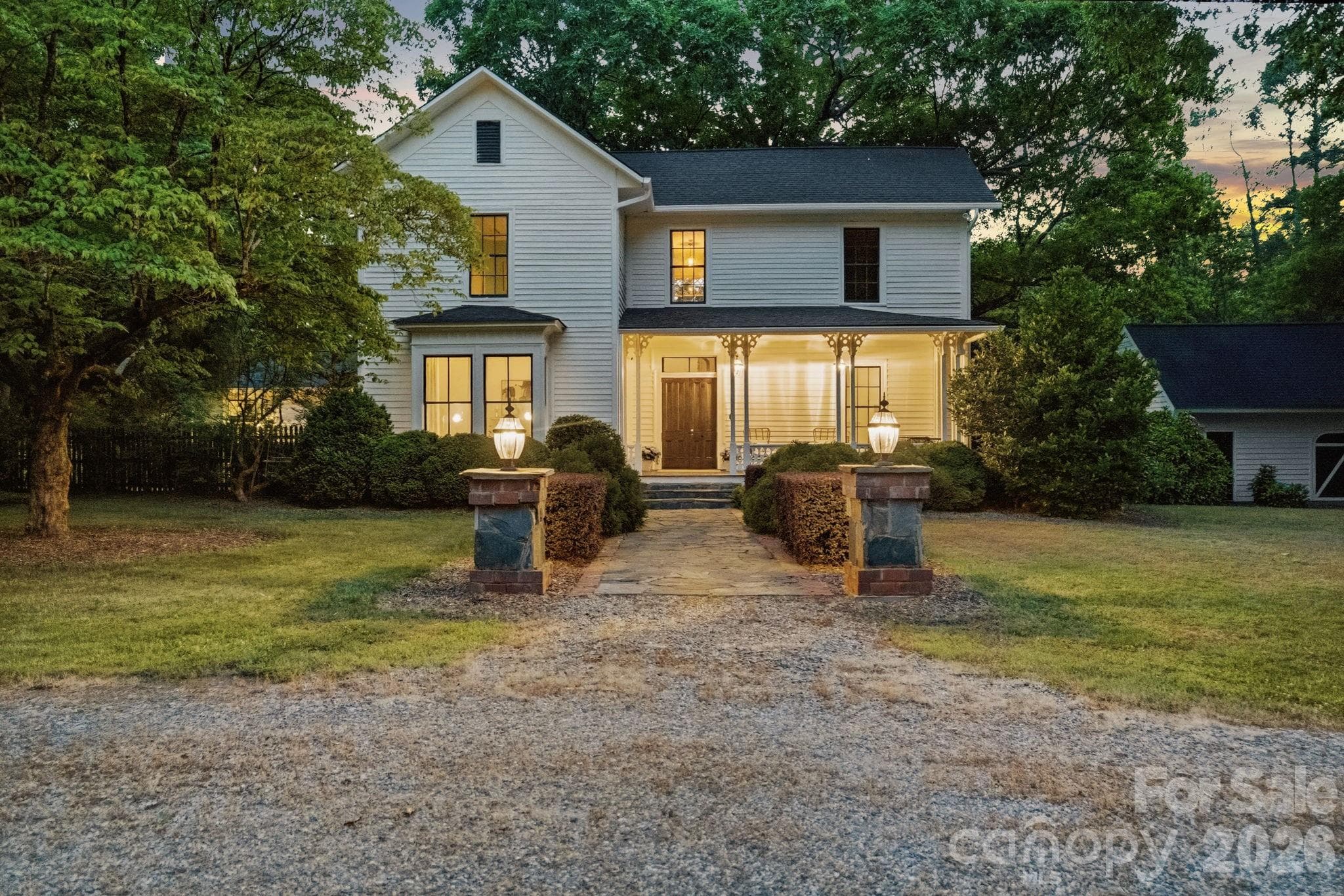 Stone and brick columns greet you at the circular driveway with a brick walk way to the front porch. - Huntersville