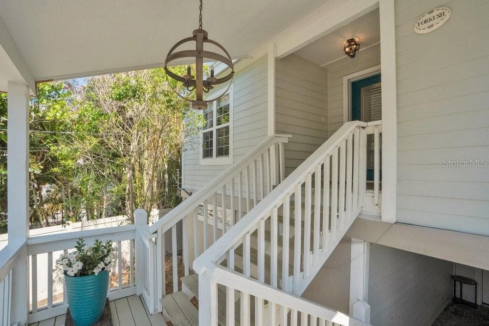 Stairs to main living area on the second floor - 3858 SHORE BLVD, OLDSMAR