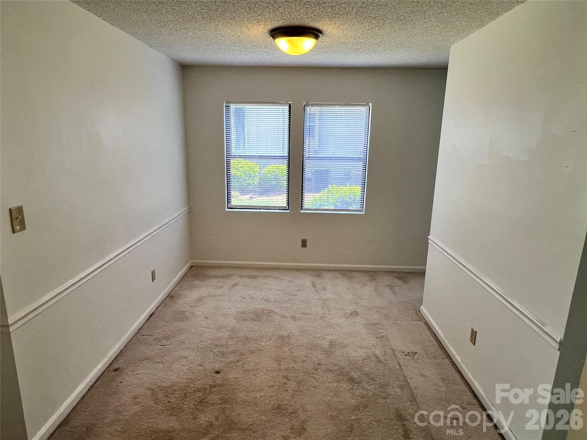 Dining room with large outside space between units. - Asheville