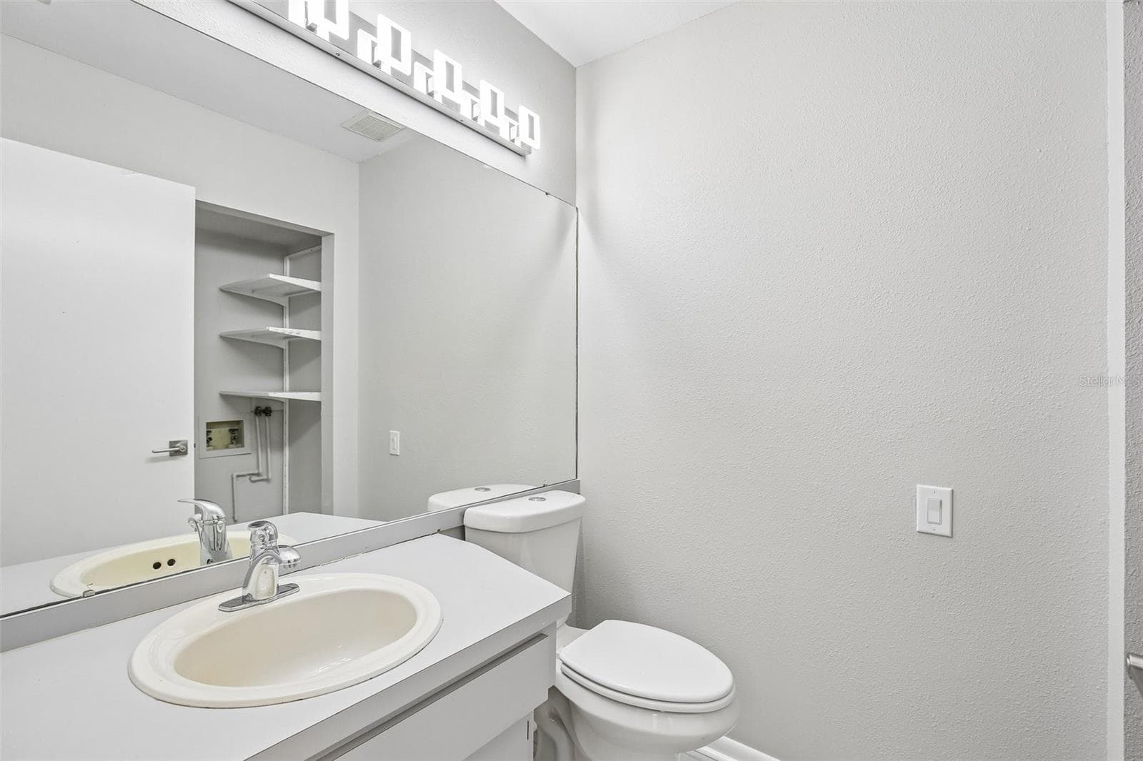 HALF BATH CONVENIENTLY LOCATED DOWNSTAIRS FOR GUEST USE - 1006 CICERO LN, BRANDON