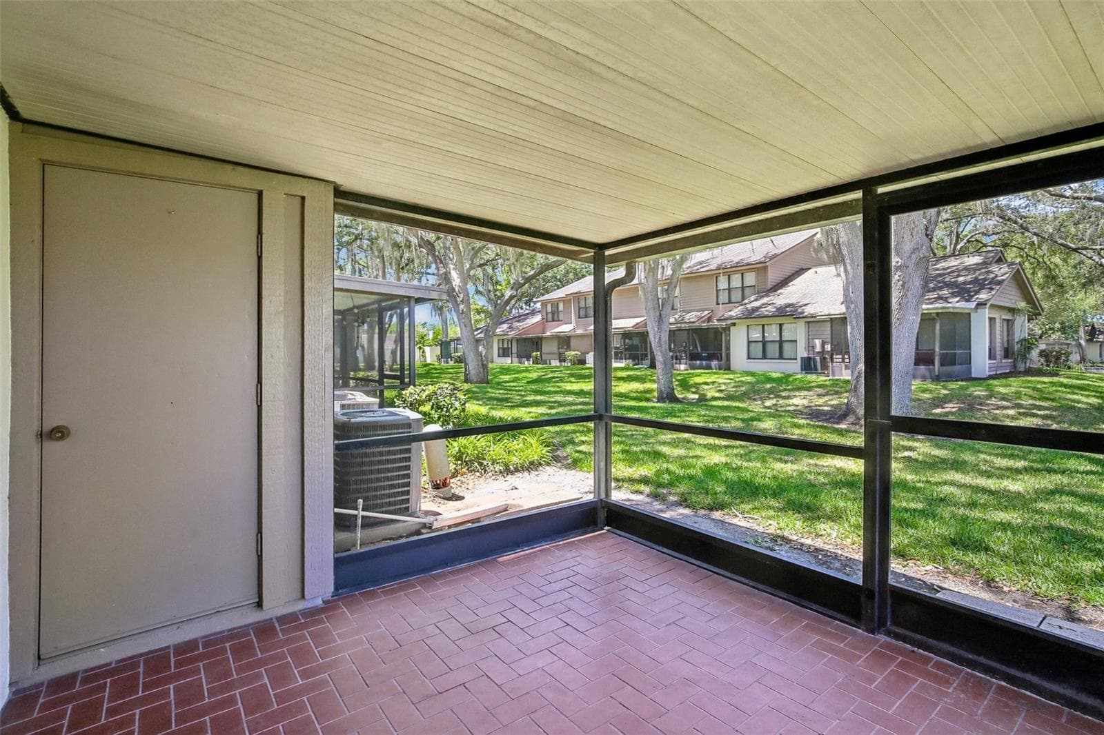 SCREENED BACK LANAI WITH STORAGE CLOSET - 1006 CICERO LN, BRANDON