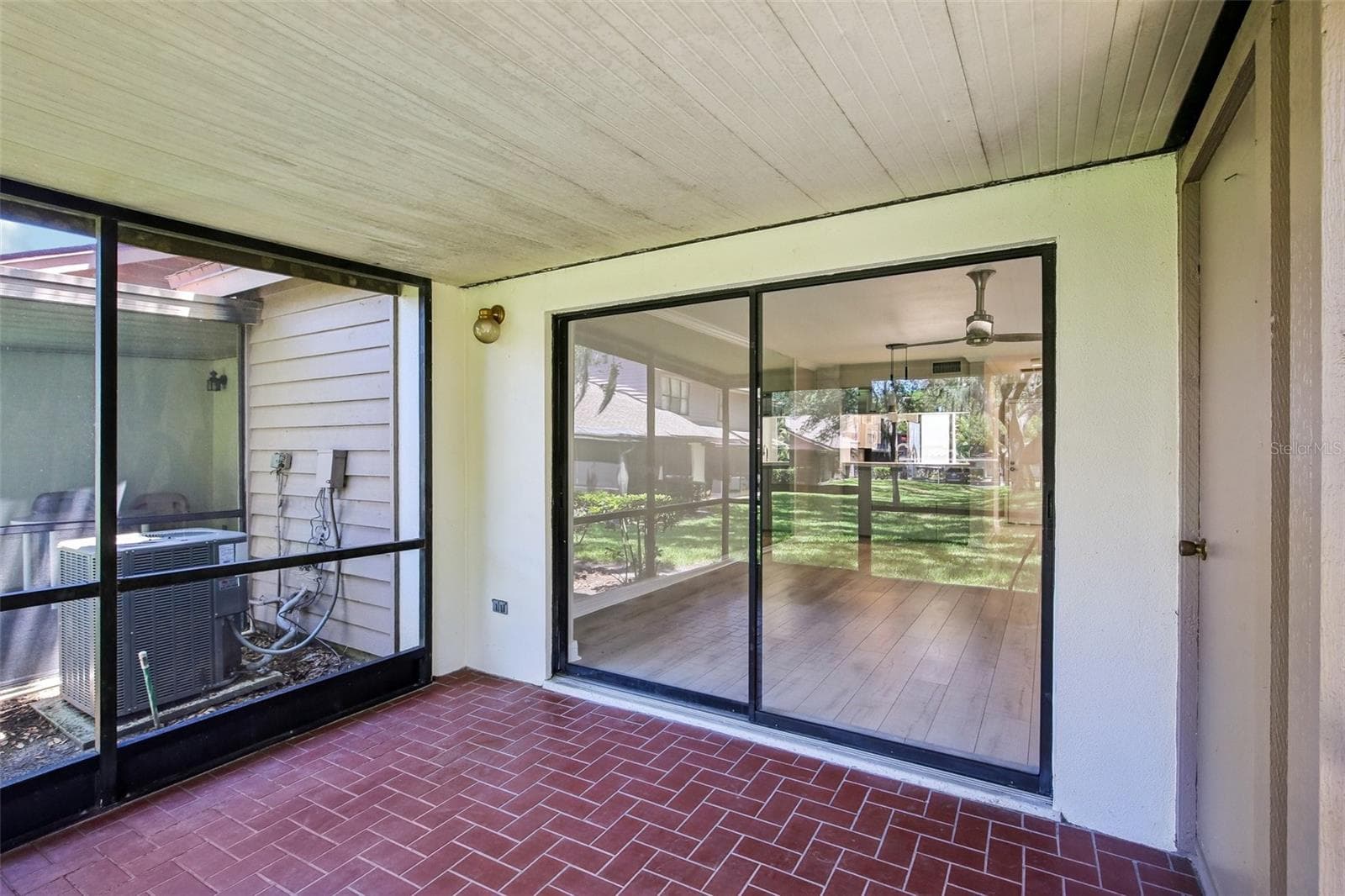 SCREENED BACK LANAI WITH STORAGE CLOSET - 1006 CICERO LN, BRANDON